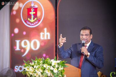 Dr. Paul Dhinakaran speaking at a ministry event