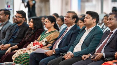 Dr. Paul Dhinakaran with family at a Karunya school event